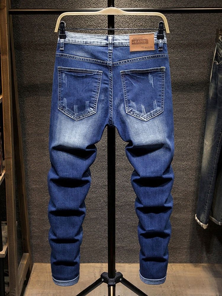 Hål Jeans Med Dragkedja I Mitten Av Midjan