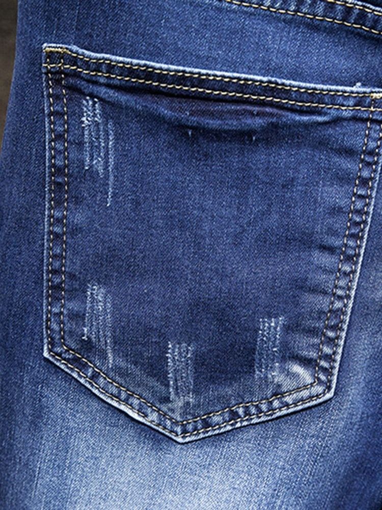 Hål Jeans Med Dragkedja I Mitten Av Midjan