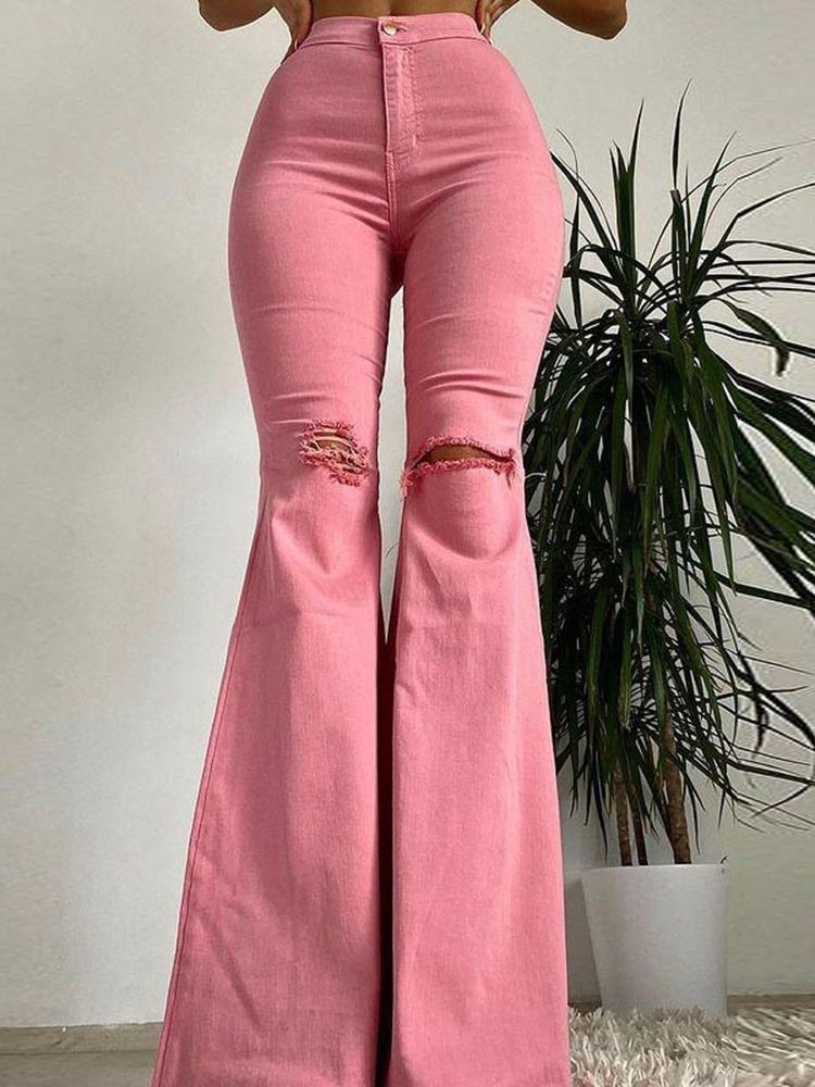 Bellbottoms Hål enfärgade damjeans med dragkedja