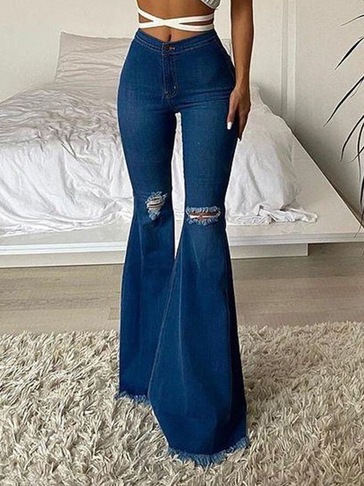 Bellbottoms Hål enfärgade damjeans med dragkedja